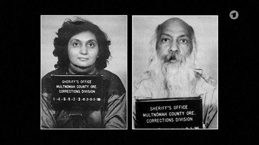 still 1h 20m 04s. Shows the police photos of Sheela and Bhagwan after their arrest