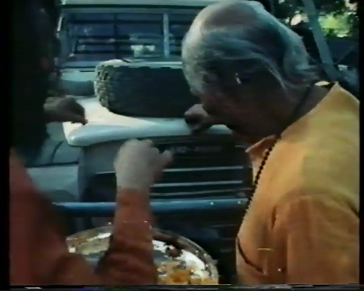 File:Bhagwan (1978) ; 14min 48sec Narendra and Dadaji blessing the new Land Rover.jpg