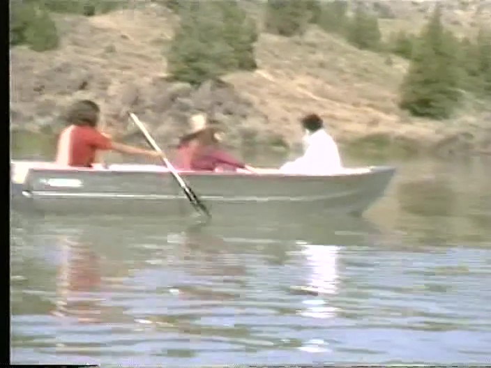 File:Osho Sheela Vivek Rowboat on Lake Patanjali (1982) ; still 04m 58s.jpg