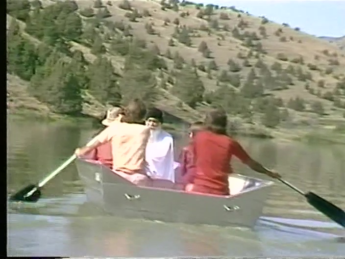 File:Osho Sheela Vivek Rowboat on Lake Patanjali (1982) ; still 02m 16s.jpg