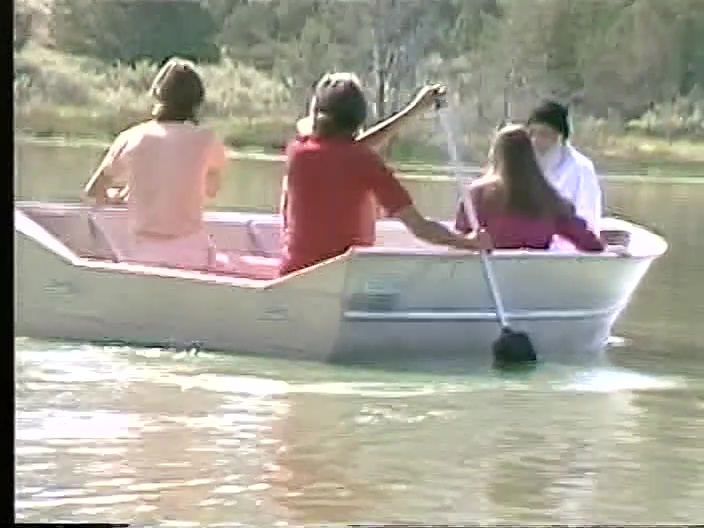 File:Osho Sheela Vivek Rowboat on Lake Patanjali (1982) ; still 00m 40s.jpg