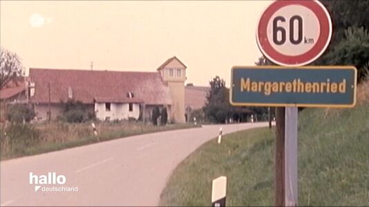 still 05m 16s. Village sign of Margaretheried, place of german commune Purvodaya