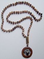 Wooden mala with stone beads and a silver commune pendant