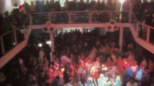 still 17m 57s. Shows scene in former Sannyas disco, Cologne