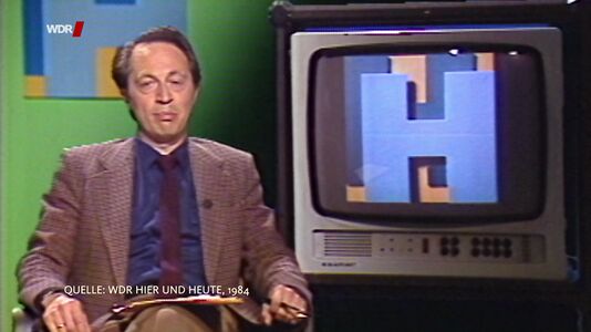 still 22m 23s. Shows commentator in german TV report „WDR Hier und Heute“ 1984