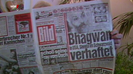 still 38m 19s. German newspaper „Bild“ with info about Bhagwan’s arrest
