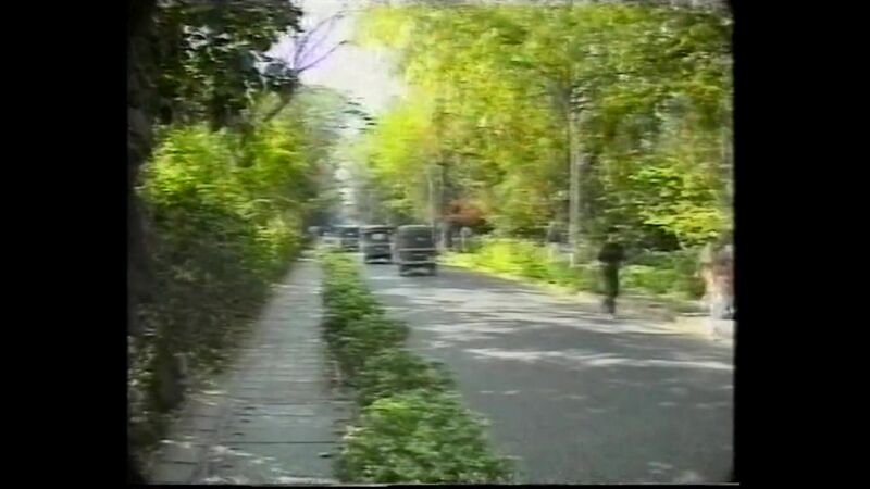 File:Welcome to Osho Commune International (1996) ; still 03m 49s..jpg