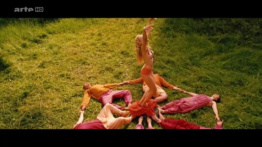 still 00h 33m 40s - Amrita meditating naked with others in the garden..